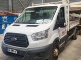 a white truck that is parked in a warehouse