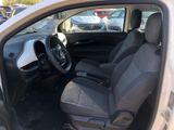 the interior of a small car with the door open