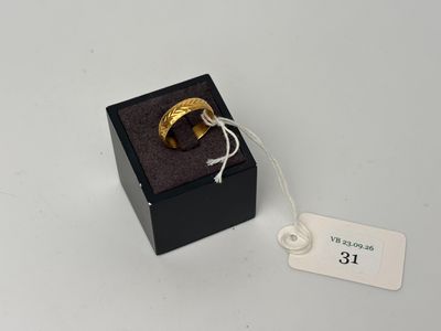 a close up of a ring in a black box with a price tag