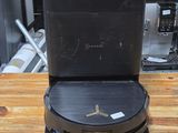 a black box sitting on top of a wooden table