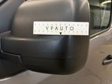 a close up of a car ' s rear view mirror with a measuring tape on it