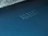 a close up view of a piece of fabric with a logo on it