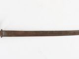 an old knife with a wooden handle on a white surface