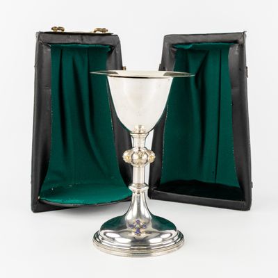 silver goblet in a case with green velvet lining