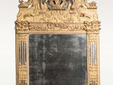 an antique mirror with a gold frame and a black background