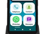 the phone is connected to a charging dock with a message on the screen