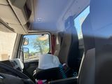 a seat in the back of a van with a bag on it