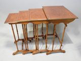 three wooden tables with turned tops and turned legs on a white background