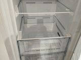 an open refrigerator with the door open in a kitchen