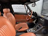 leather seats in a car with a sign on the back of it