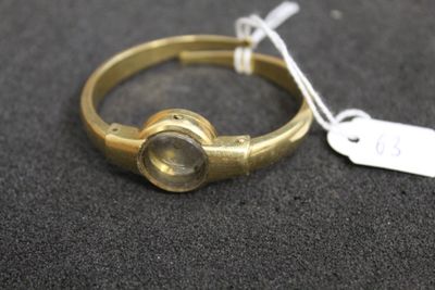 an image of a gold ring with a stone in the middle