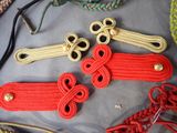 some red and yellow cords and a pair of scissors on a table