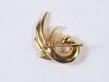 an image of a gold brooch or pin with a bird on it