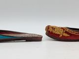 these are two pairs of shoes that are sitting on a white surface