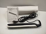 a hair dryer and a box on a table