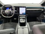 the interior of a car with a steering wheel, dashboard, and a touch screen