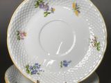 three plates with floral designs are stacked on top of each other