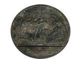an image of a bronze medal with a picture of a man on a horse