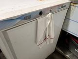 a white dishwasher sitting in the middle of a kitchen