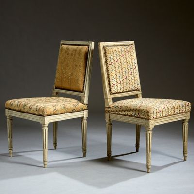 pair of chairs with upholstered back and upholstered upholstered seat
