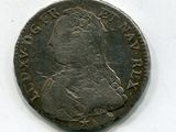 gros plan d'une pièce de monnaie sur une surface blanche