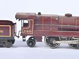 a toy train on a white surface with a white background