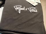 a pile of shirts that are on a table