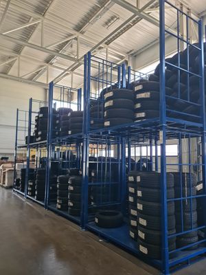 a large rack with tires on it in a warehouse