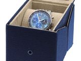 a blue watch in a blue box on a white background