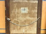 an old picture frame with a rope hanging from it ' s side