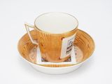 a cup and saucer with a picture on it