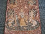 a picture of a tapestry on the floor of a living room