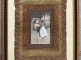 framed photograph of a woman in a white dress and a man in a black suit