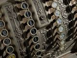 a close up of an old cash register with numbers on it