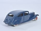 a blue toy car that is sitting on a white surface