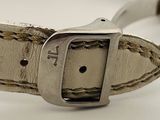 an image of a white leather belt with a silver buckle