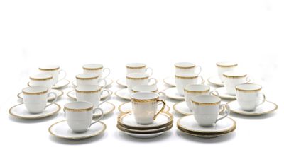 a lot of cups and saucers sitting on a table