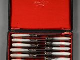 an image of a set of six knives in a red box
