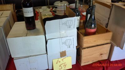 many bottles of wine sitting on a table in a room