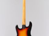 an electric guitar on a stand against a white background