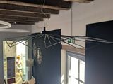a picture of a living room with blue walls and wood beams