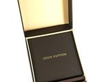 louis vuitton black and gold watch in box on white background