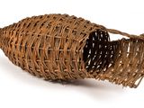 a wicker cornucon on a white background