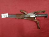 a close up of a knife on a red background with a price tag