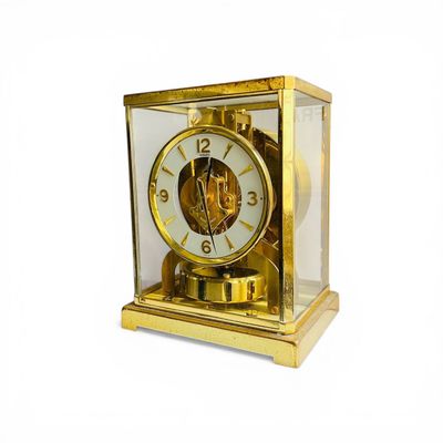 JAEGER-LECOULTRE ATMOS Horloge en métal doré et plexiglas re…