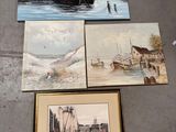 several paintings of boats are displayed on the floor of a building