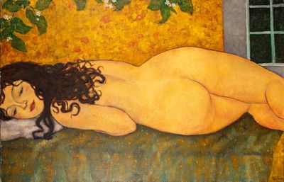 un tableau représentant une femme nue allongée sur un canapé