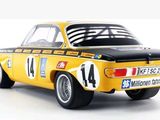 a model of a yellow car with a number on it