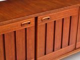 an image of a wooden cabinet with doors and drawers