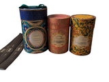 three tins that are sitting next to each other